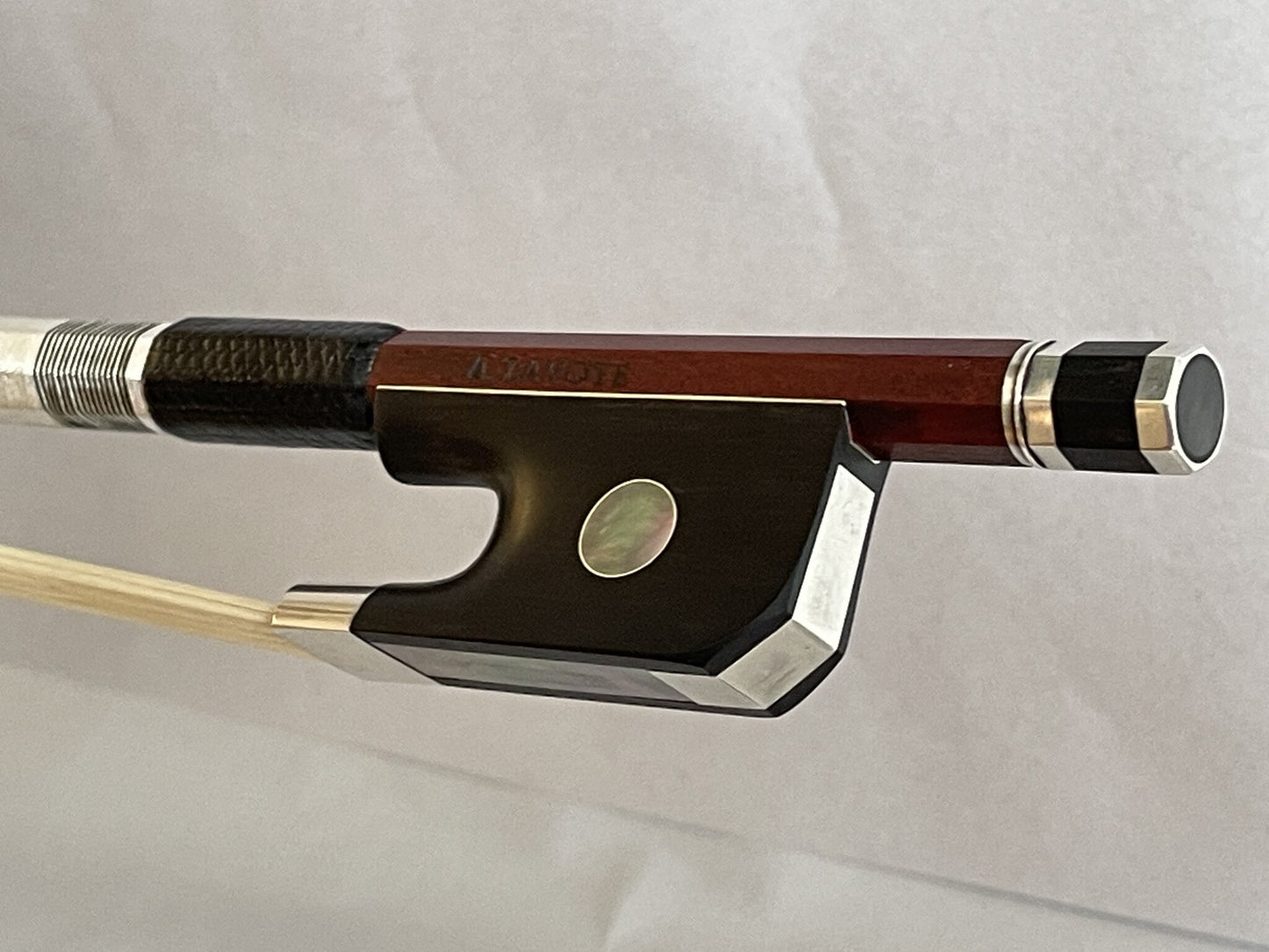 Andre LAVOYE cello bow, round Pernambuco stick, ebony & silver mounted with angled heel, Montreal, Quebec, 80.6g